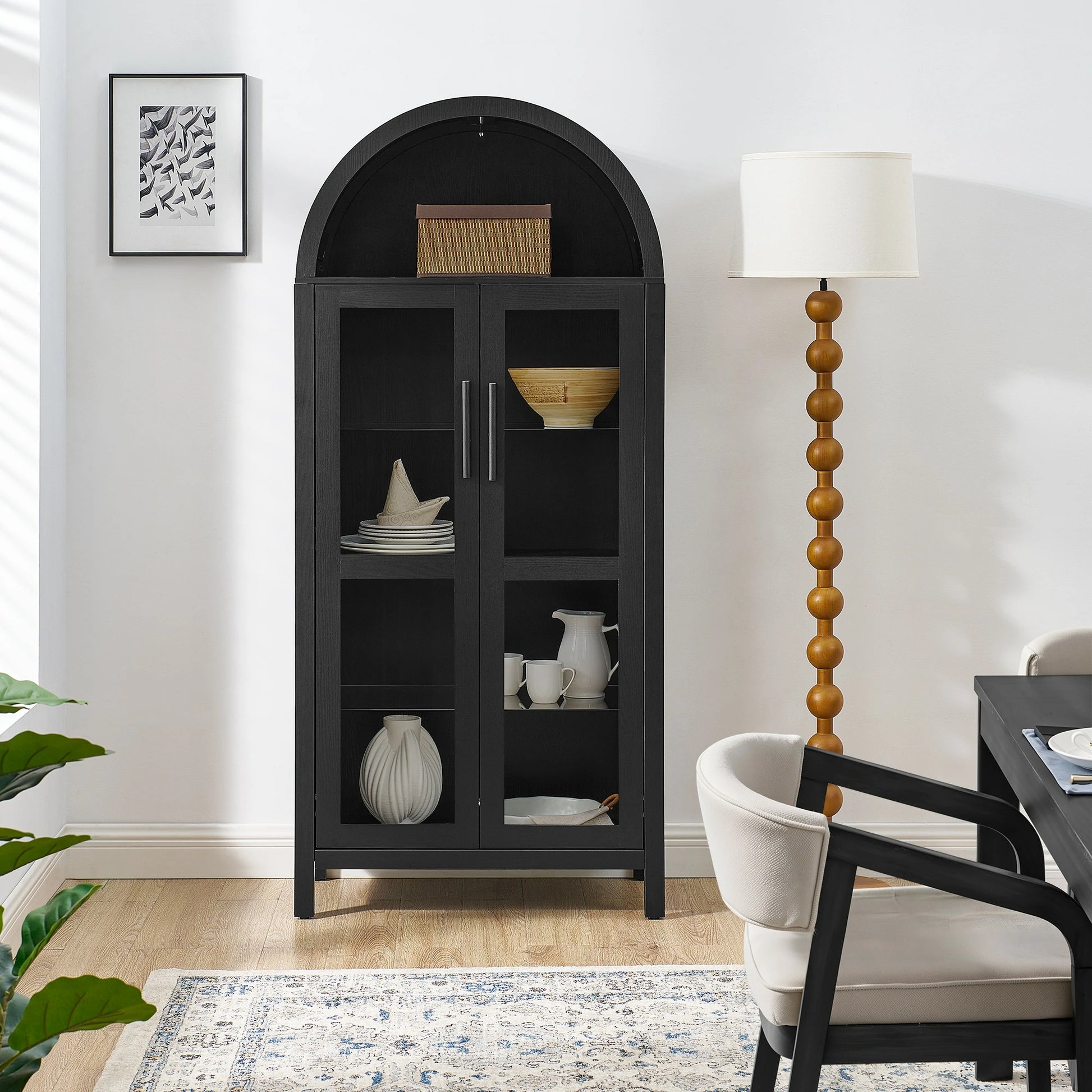 Blackarchedglassdisplaycabinetinbrightdiningroom_pairedwithwoodenbeadfloorlampandmoderndiningfurniture_d4d82a09-8673-4425-8e79-2c6995904aa7