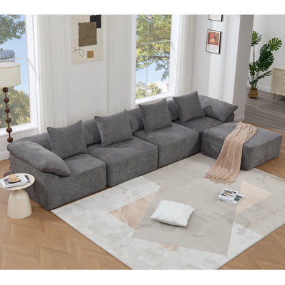 Graychenillemodularsectionalsofaarrangedinaspaciouslivingroomlayout