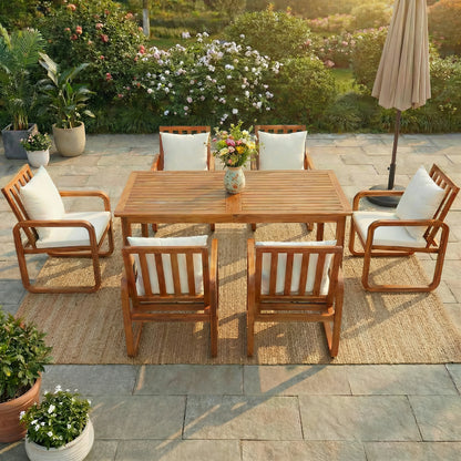Modernoutdoordiningsetinawarmsunsetbackyardsetting_featuringsolidacaciawoodtableandcushionedchairs_perfectforeveningmealsandoutdoorentertaining._96e3e92e-8ebf-46e0-ba3f-d136c1cd4080