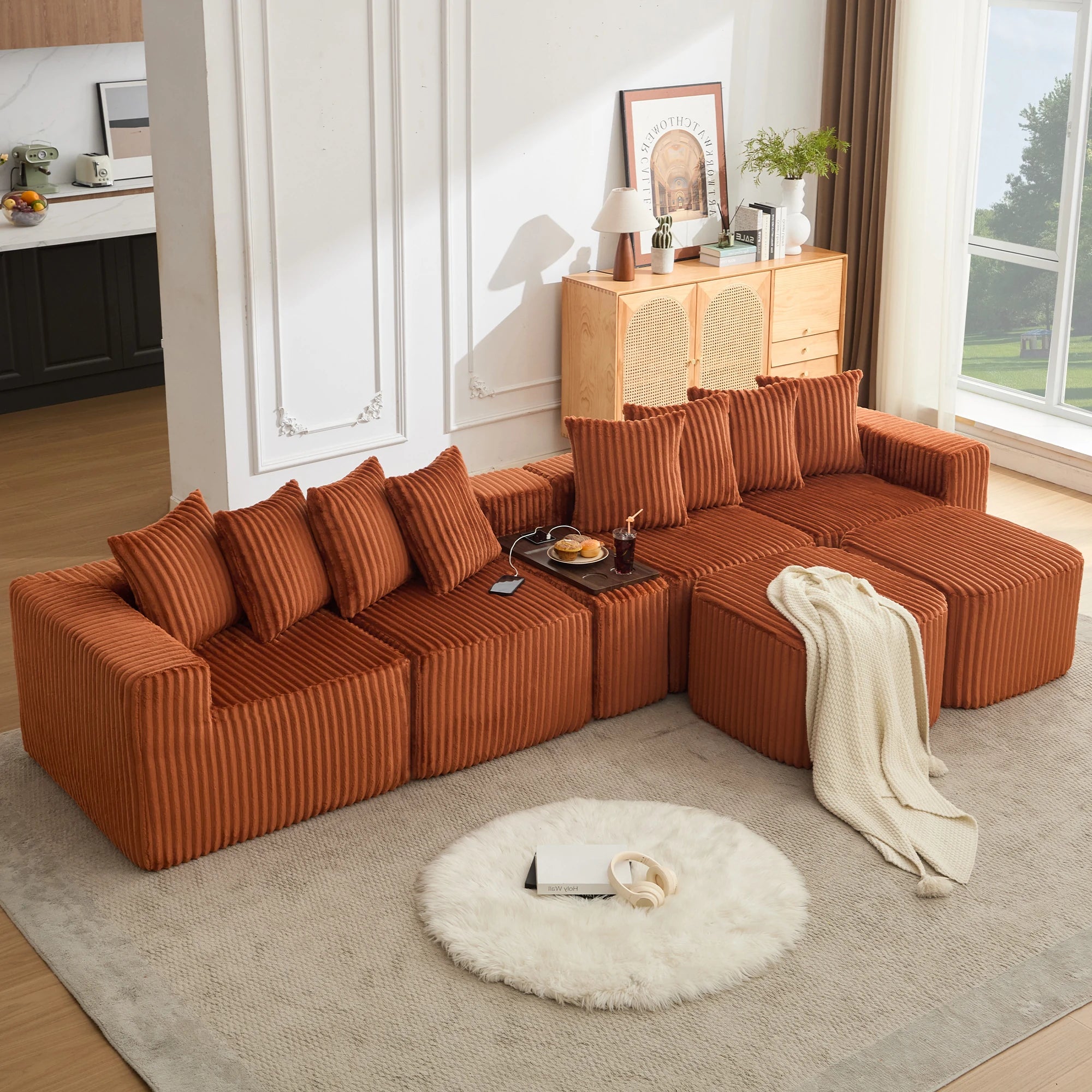 Orange_u_shaped_modular_sectional_sofa_with_corduroy_fabric_deep_seats_movable_ottoman_built-in_USB_and_wireless_charging_and_cup_holder_console_for_modern_living_rooms.