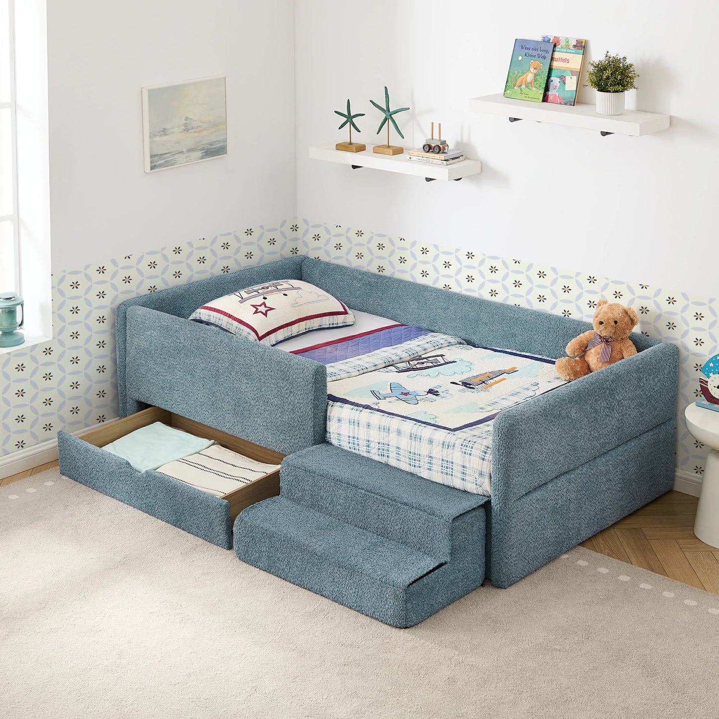 Softupholsteredkidsbedinbluebouclefabricfeaturingapull-outstoragedrawerandcushionedstepstool.Designedforsafety_comfort_andspace-savingfunctionality.