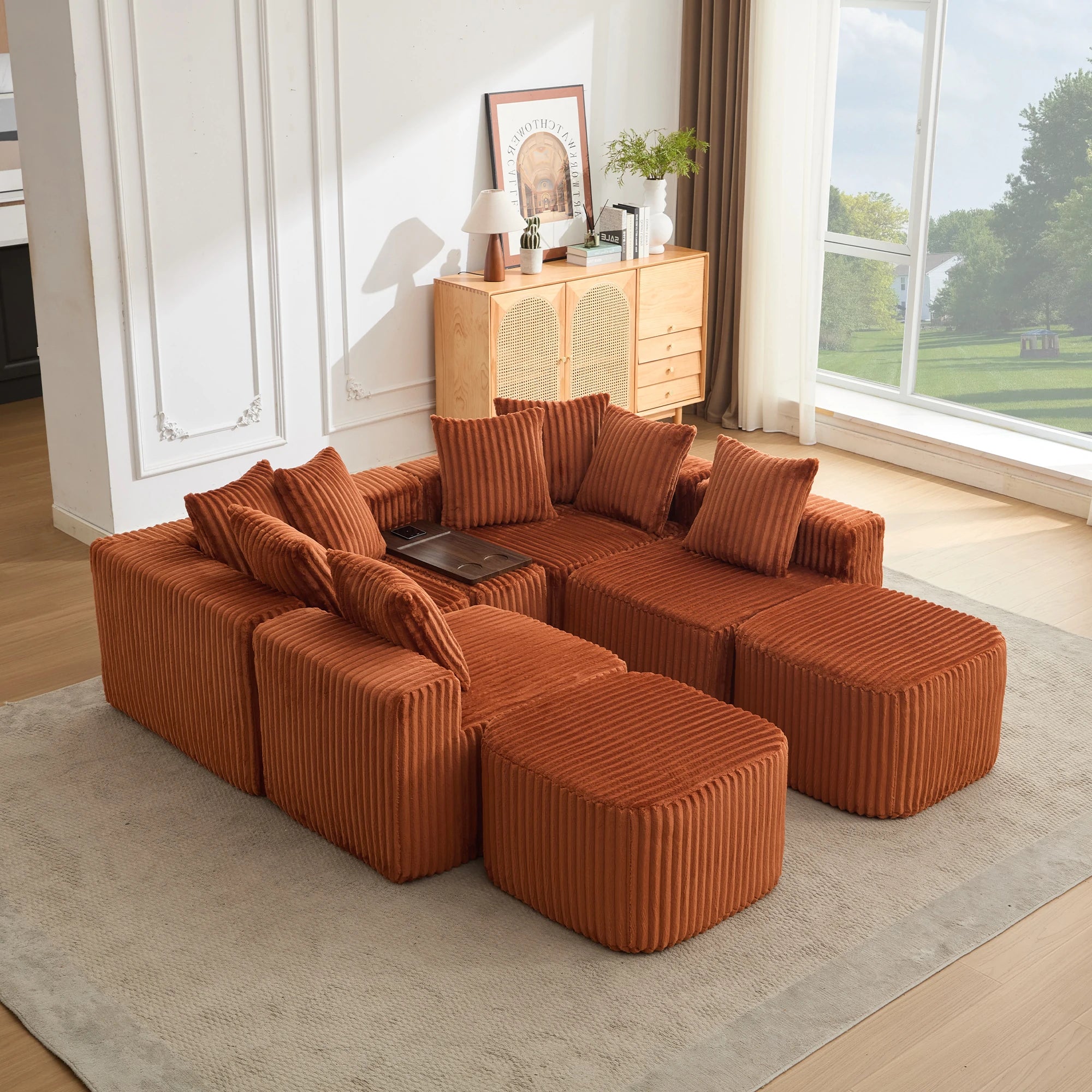 This_image_showcases_the_orange_modular_sofa_in_a_compact_conversational_layout_featuring_soft_corduroy_upholstery_movable_ottomans_supportive_back_cushions_and_a_multifunct