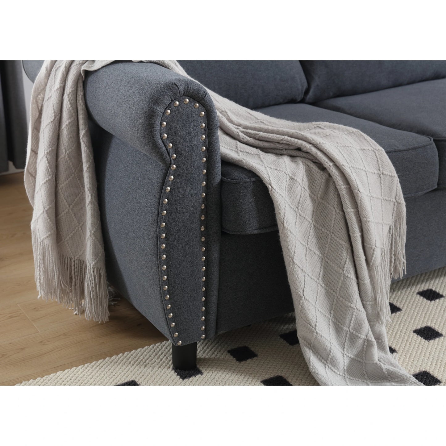 dark-blue-sectional-sofa-rolled-arm-nailhead-detail